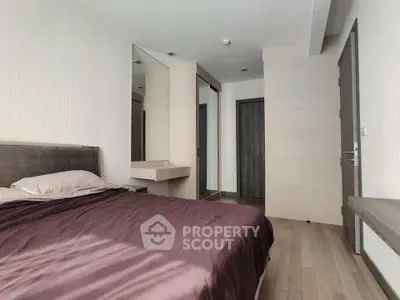 Modern bedroom with sleek design and ample natural light