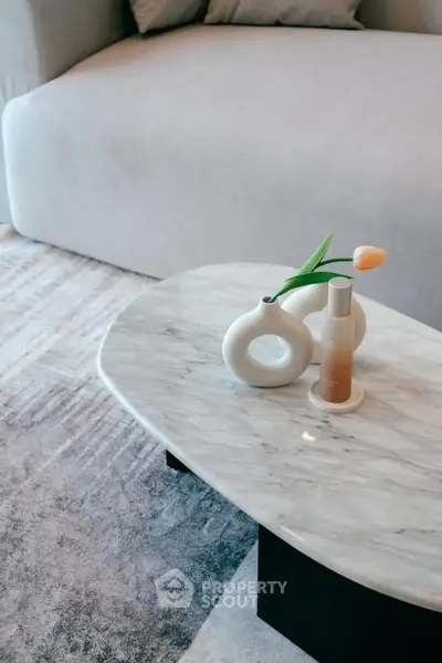 Elegant living room with marble coffee table and modern decor