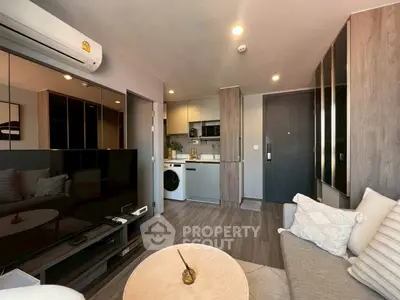 Modern living room with open kitchen and stylish decor