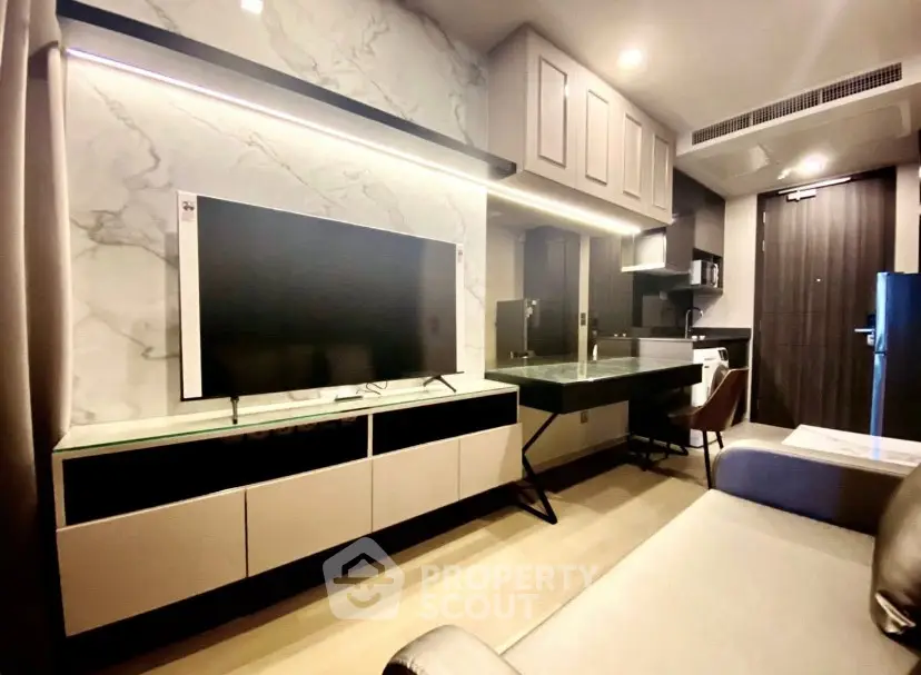 Modern living room with sleek TV setup and stylish furniture