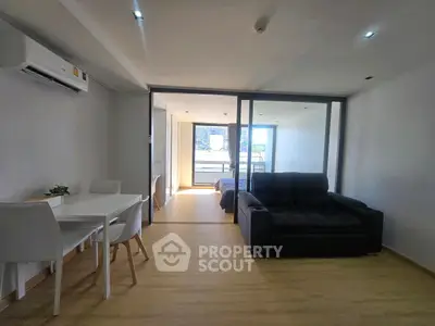 Modern apartment interior with open layout and balcony view