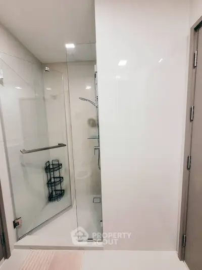 Modern bathroom with glass shower enclosure and sleek design