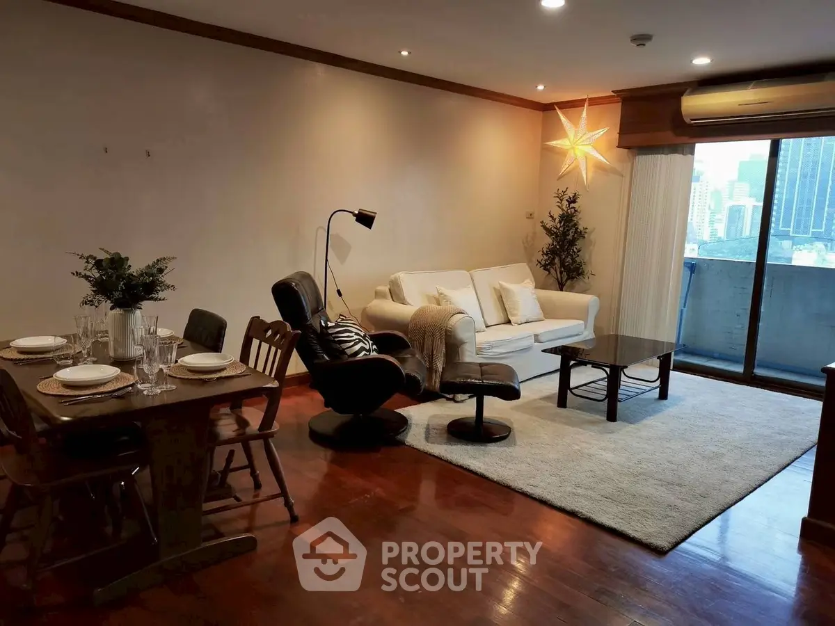Spacious living room with modern decor and city view balcony