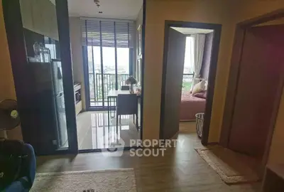Modern apartment interior with open kitchen and balcony view