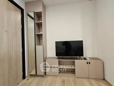 Modern living room with sleek TV stand and mirror
