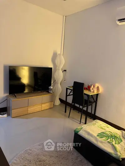 Cozy living room with modern TV setup and stylish decor