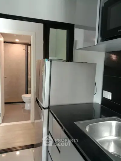 Modern kitchen with sleek design and stainless steel sink