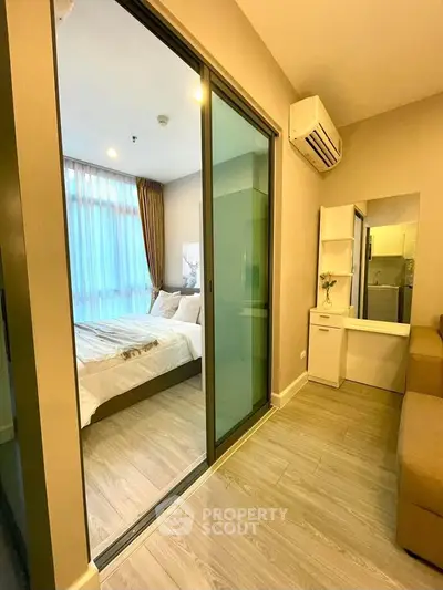 Modern bedroom with glass sliding doors and cozy decor