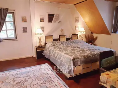 Charming bedroom with cozy decor and natural light, perfect for relaxation and comfort.