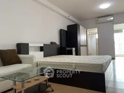 Spacious modern bedroom with stylish furniture and natural light