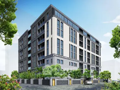 Modern luxury apartment building with sleek design and lush greenery