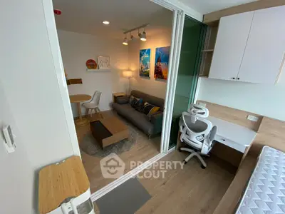 Modern studio apartment with stylish living area and workspace