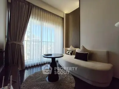 Elegant living room with large window and stylish furniture