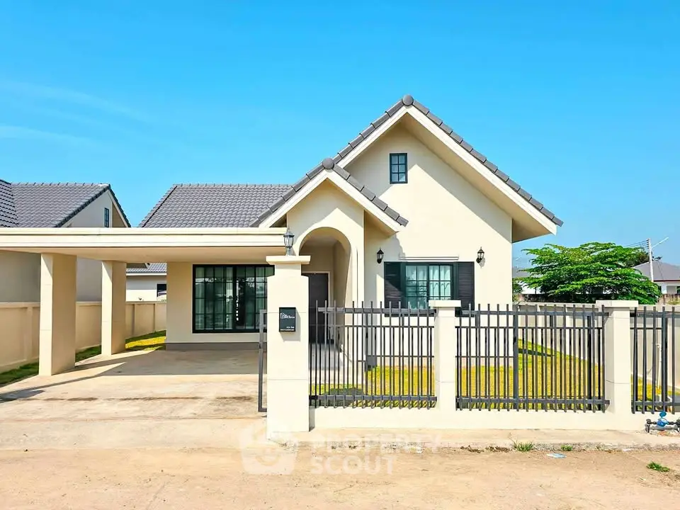 Charming single-story home with modern design and spacious driveway in a serene neighborhood.