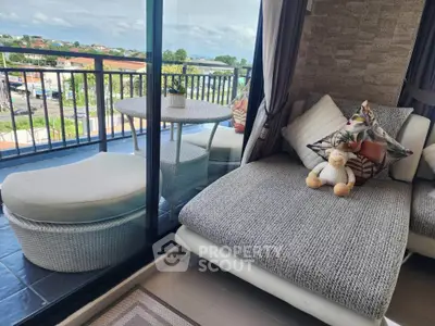 Chic balcony with cozy seating and plush cushions offering a serene view, perfect for relaxation.