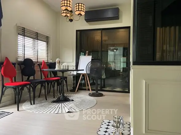 Chic modern living room with stylish decor and ample natural light.