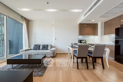 Modern open-plan living room with sleek kitchen and elegant dining area