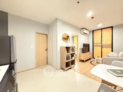 Modern living room with open layout and stylish furniture in a cozy apartment.