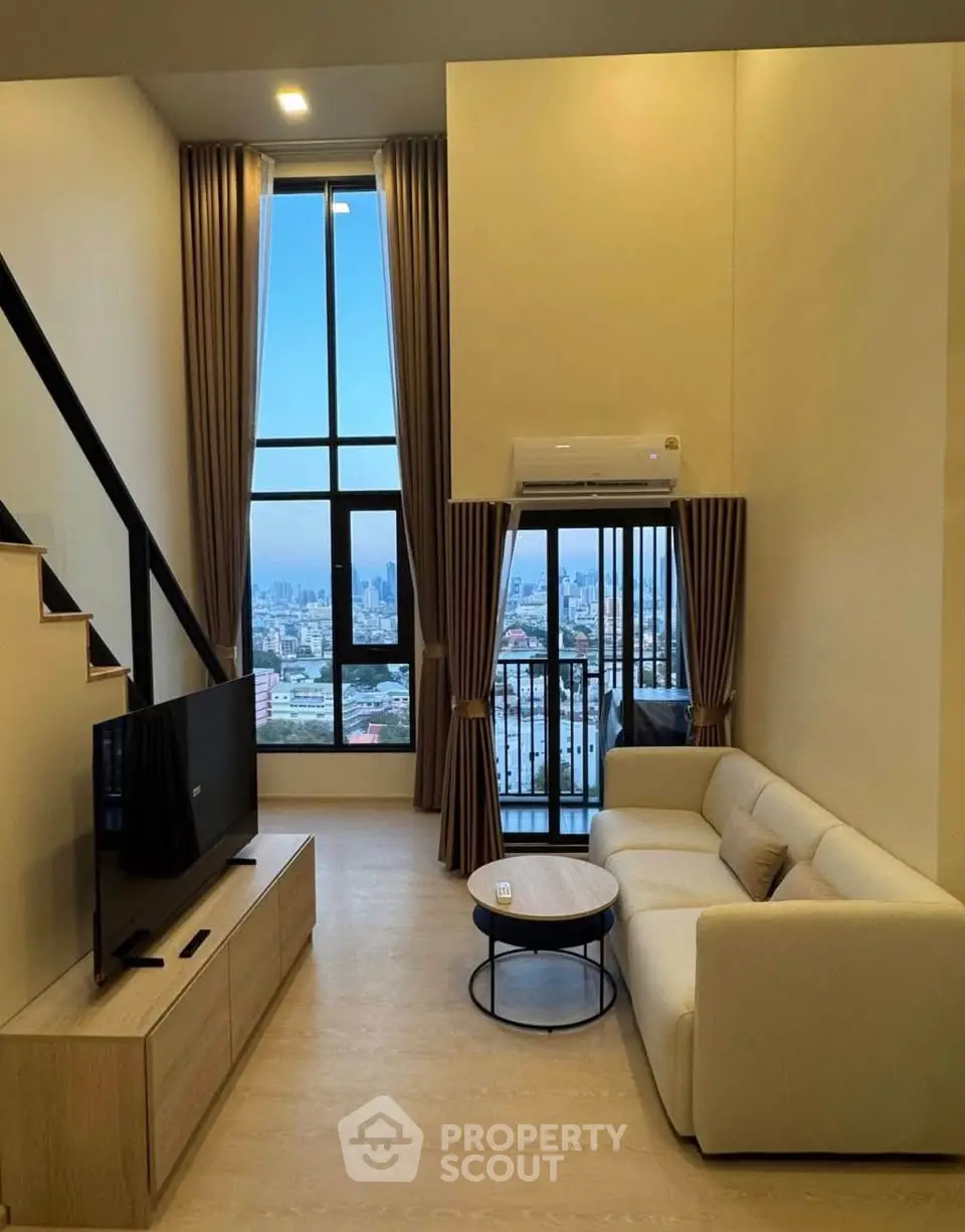 Modern living room with high ceiling and stunning city view