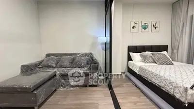 Modern studio apartment with stylish decor and cozy furnishings.