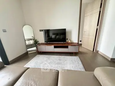 Modern living room with sleek TV stand and cozy seating area