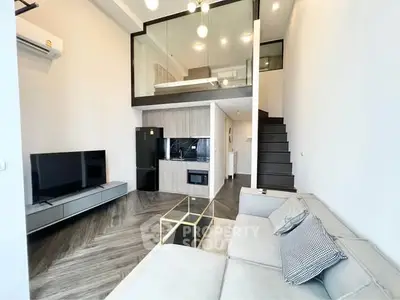 Modern loft apartment with stylish living room and mezzanine bedroom