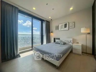 Modern bedroom with stunning city view and elegant decor