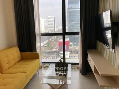 Modern living room with city view, yellow sofa, and wall-mounted TV.