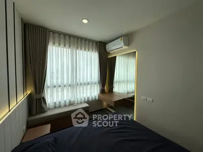 Modern bedroom with large window and stylish decor