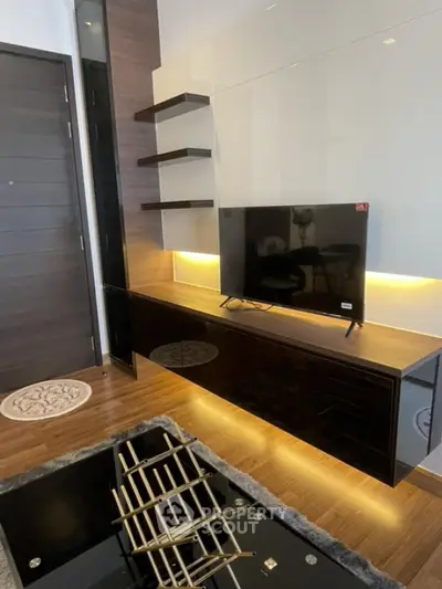 Modern living room with sleek TV unit and ambient lighting