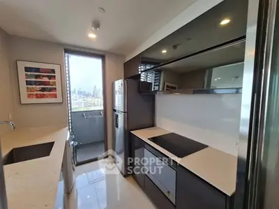 Modern kitchen with sleek design and city view from balcony