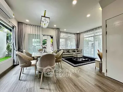 Elegant living room with modern decor and large windows for natural light