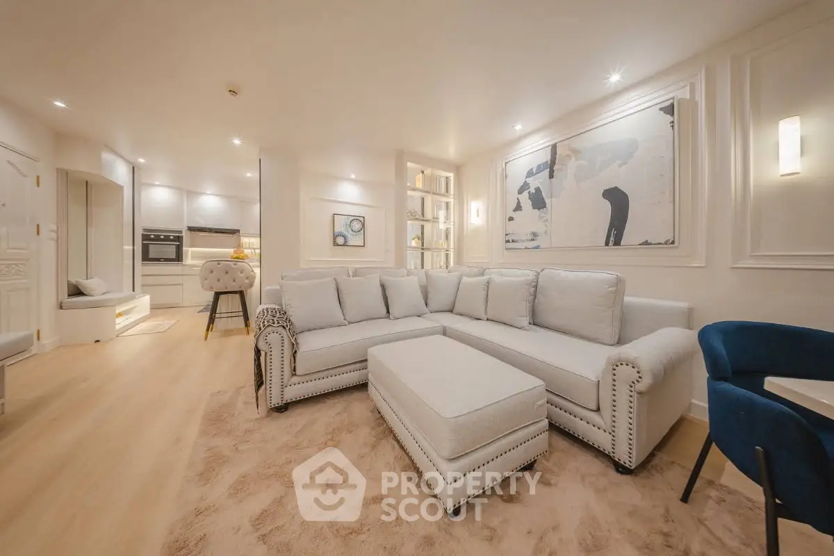 Luxurious living room with elegant decor and spacious seating area in modern apartment.