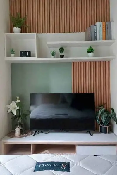 Modern living room with stylish TV unit and decorative plants