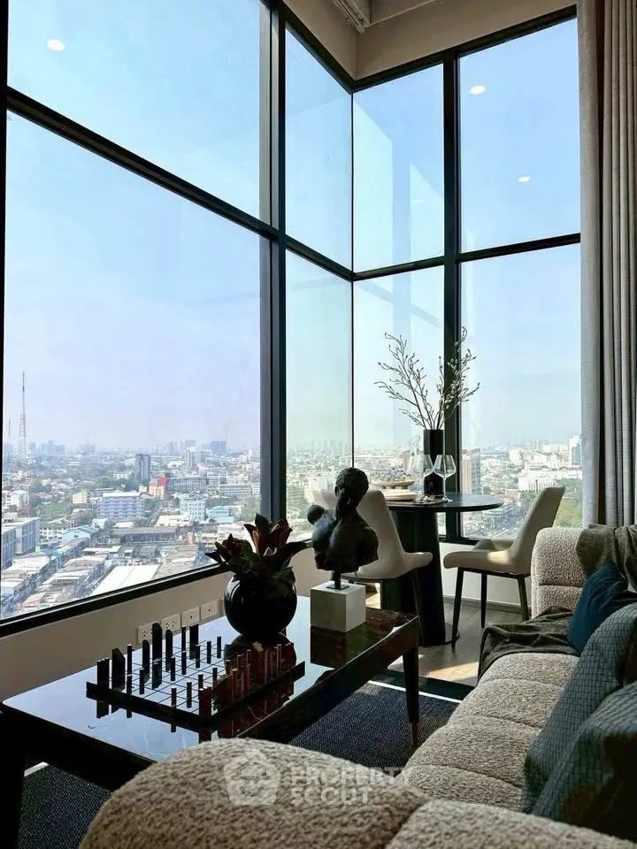 Luxurious corner unit living room with panoramic city views and elegant decor.