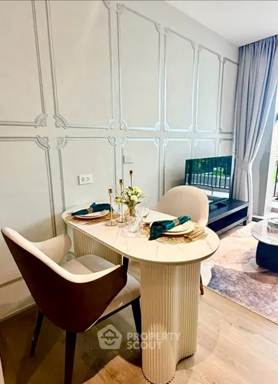 Elegant dining area with stylish table and chairs in modern apartment interior