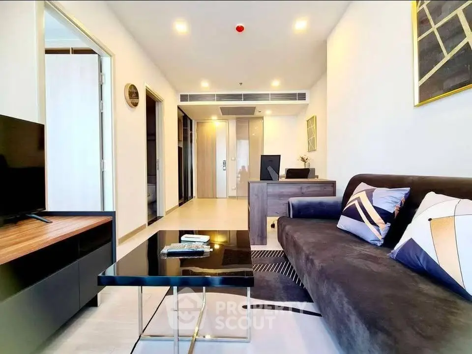 Modern living room with stylish decor and comfortable seating in a contemporary apartment.