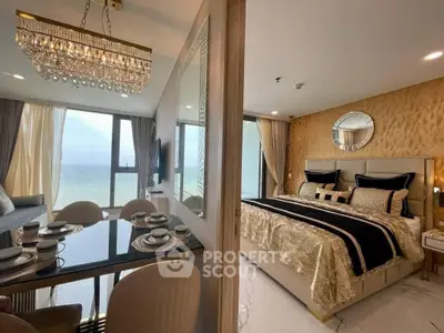 Luxurious beachfront bedroom with elegant dining area and stunning ocean view.
