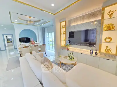 Luxurious living room with elegant decor and spacious dining area, perfect for entertaining guests.