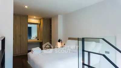 Modern bedroom with stylish decor and ample storage space
