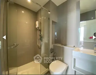 Modern bathroom with glass shower and sleek fixtures