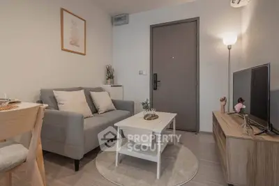 Cozy modern living room with stylish decor and neutral tones, perfect for relaxation and entertainment.
