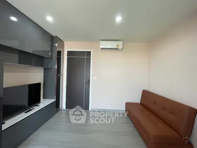 Modern living room with sleek furniture and air conditioning