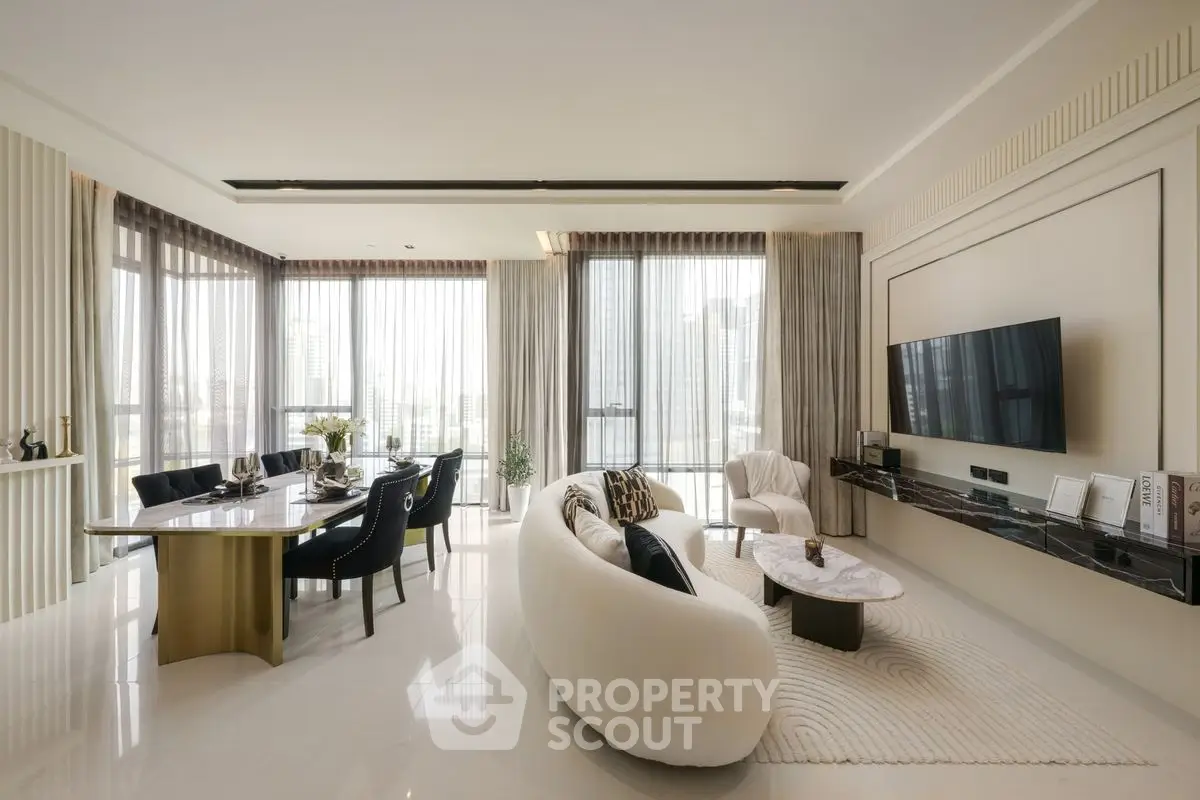 Luxurious modern living room with elegant decor and large windows offering city views.