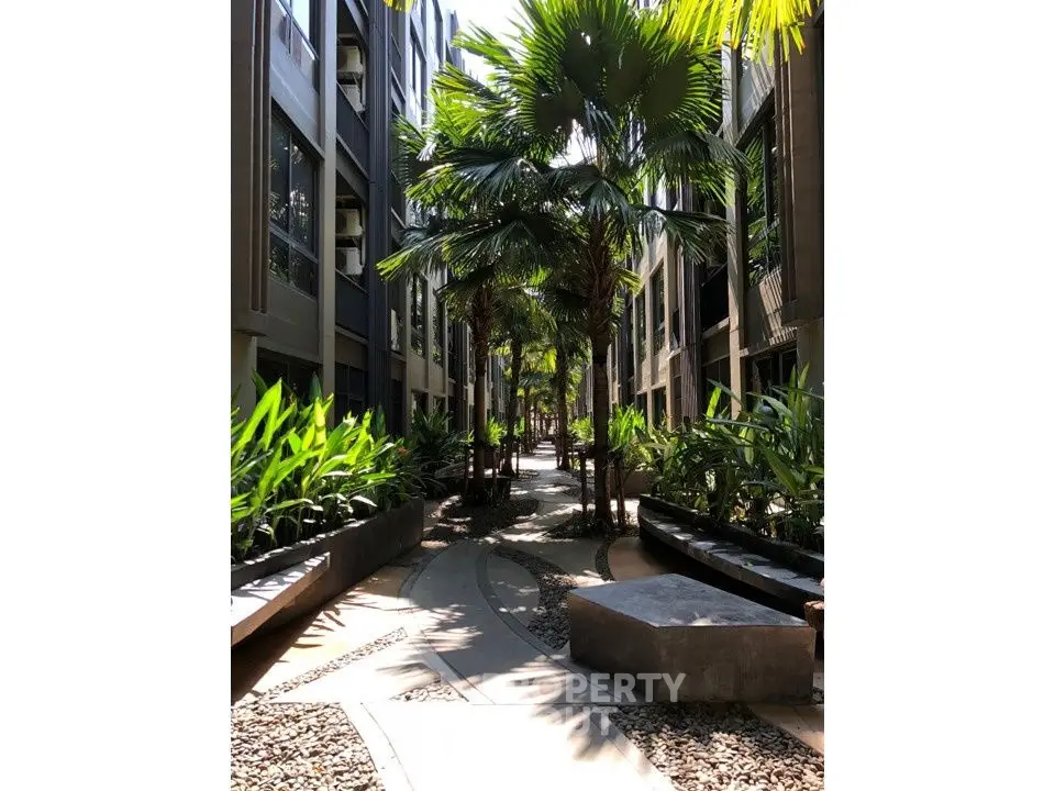 Stunning garden pathway with lush greenery in modern residential complex