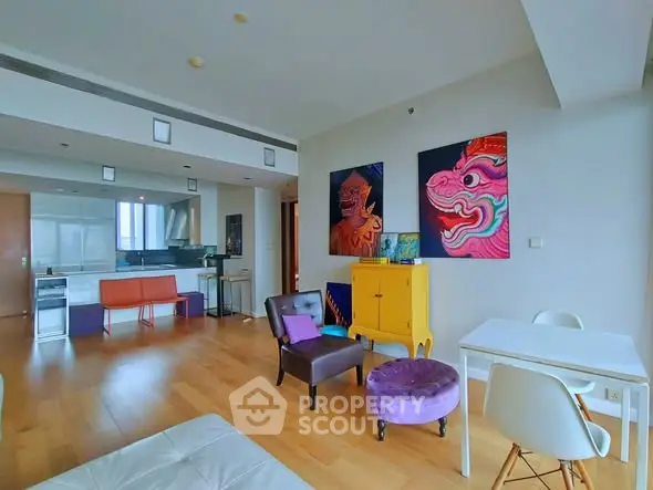 Spacious modern living room with vibrant decor and open kitchen layout