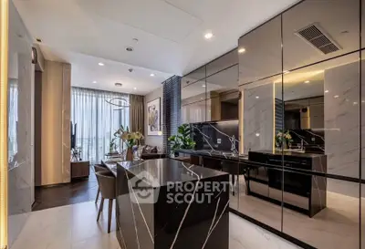 Luxurious modern kitchen with sleek black marble island and open layout