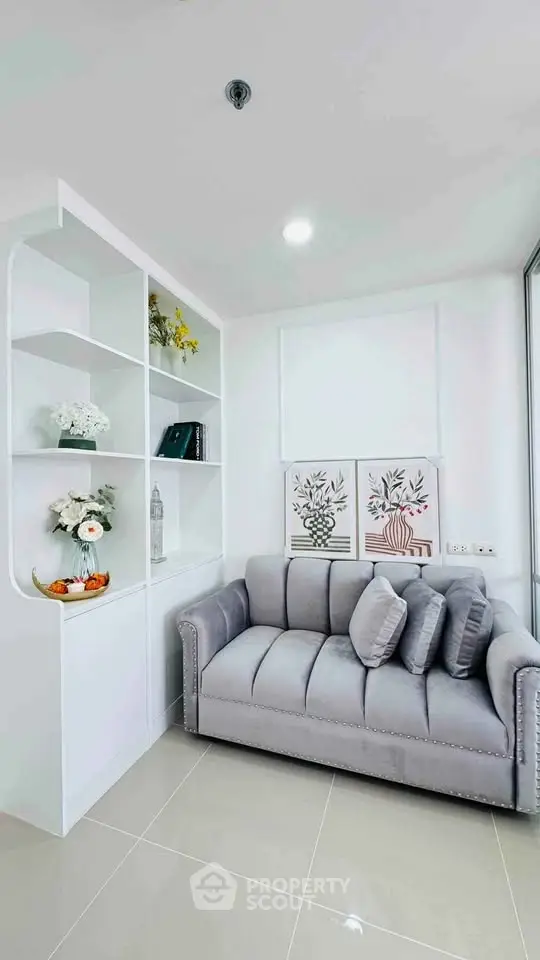 Chic modern living room with stylish sofa and decorative shelving