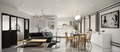 Modern open-plan living and dining area with stylish decor and contemporary lighting.