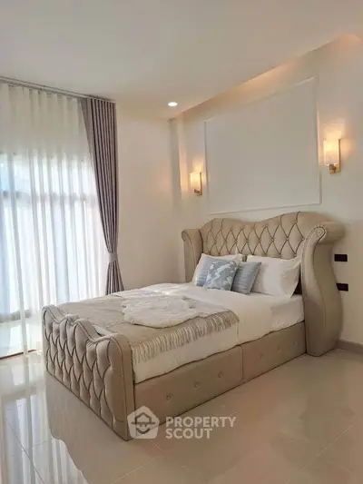Luxurious bedroom with elegant bed and soft lighting, perfect for relaxation and comfort.